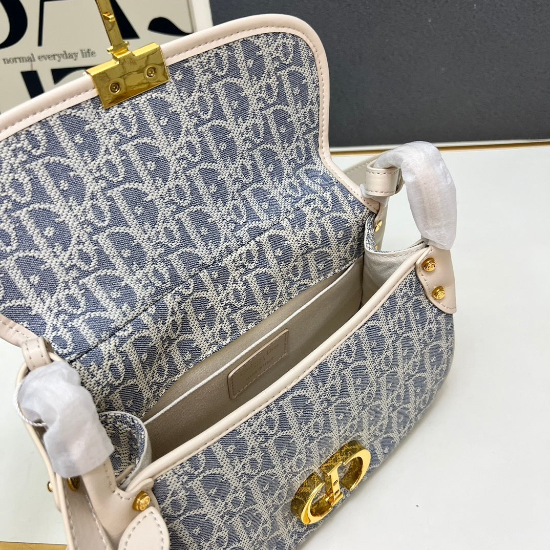 Christian  30 Montaigne Bag – Blue Oblique Jacquard Canvas with Gold-Finish CD Clasp