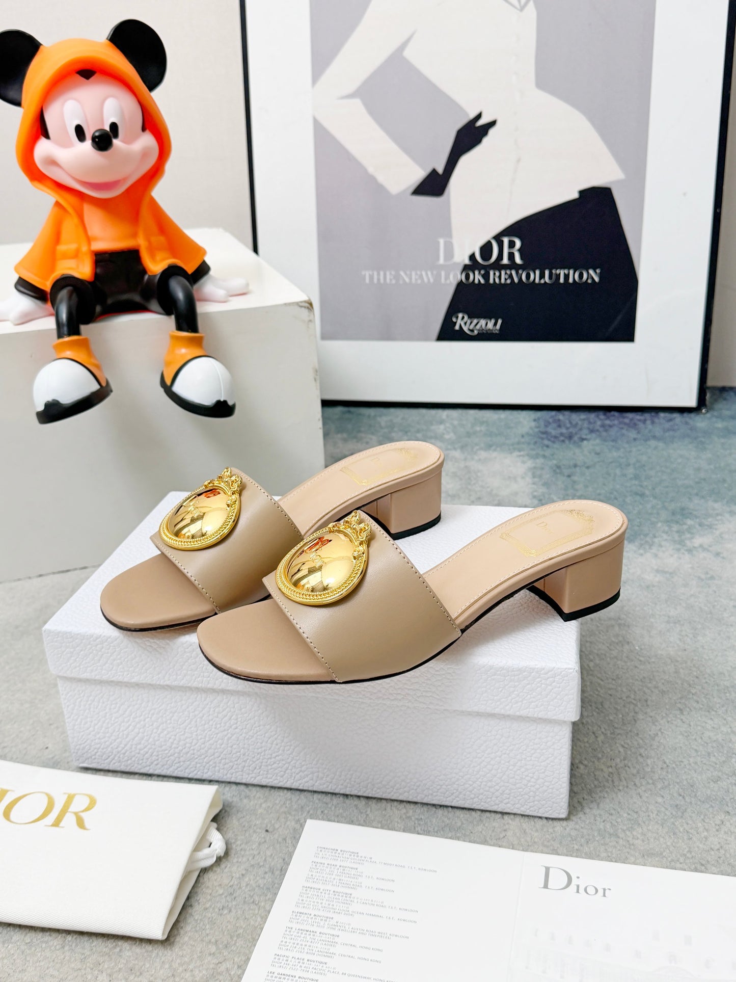 CD Heeled Mules – Alabaster Beige Smooth Lambskin Slide Sandals with Gold-Finish Crest