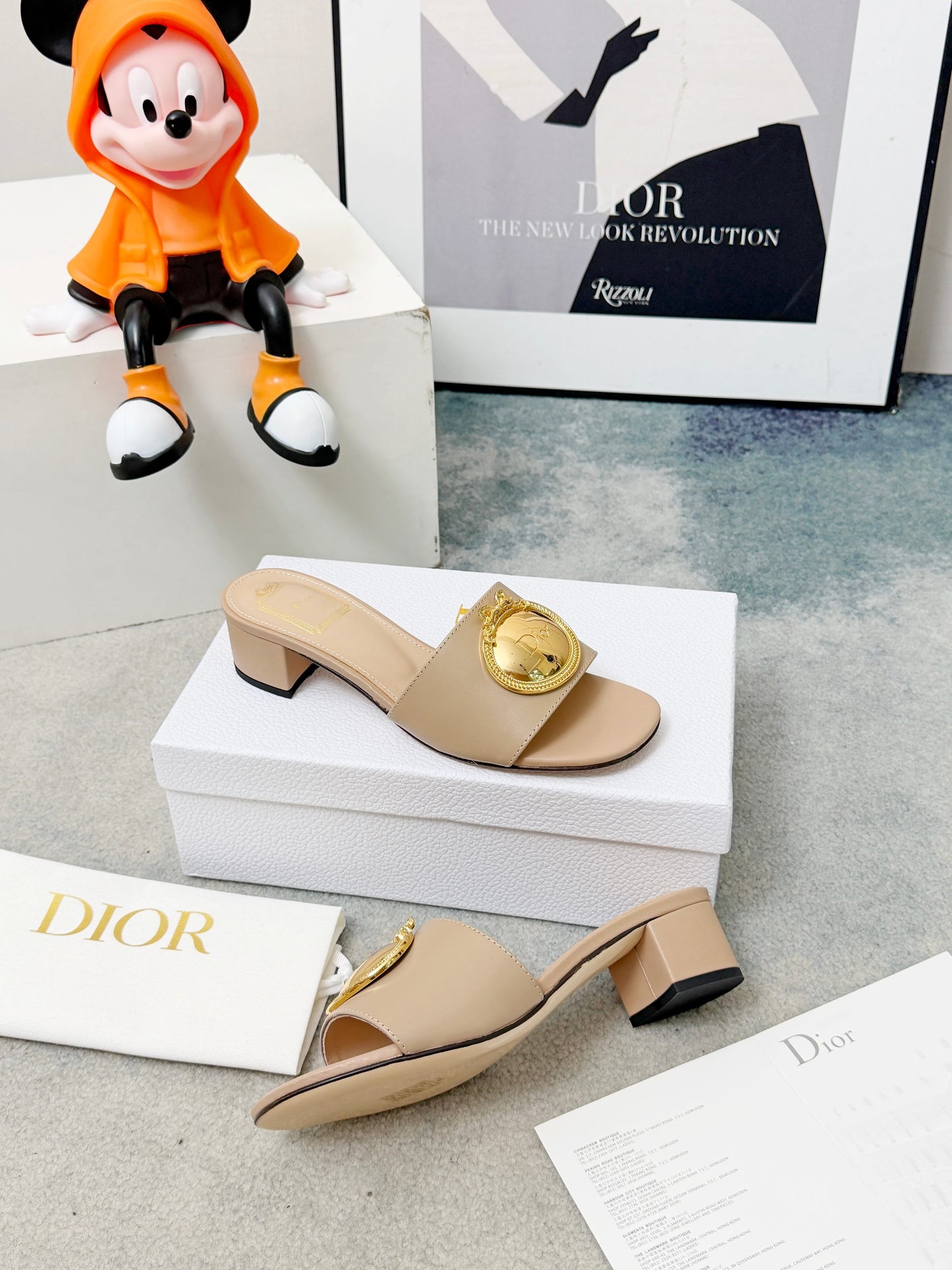 CD Heeled Mules – Alabaster Beige Smooth Lambskin Slide Sandals with Gold-Finish Crest