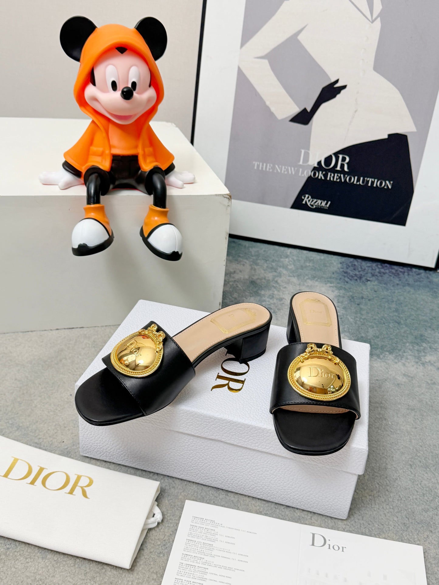 CD Heeled Mules – Smooth Black Lambskin Slide Sandals with Oversized Gold-Tone Medallion