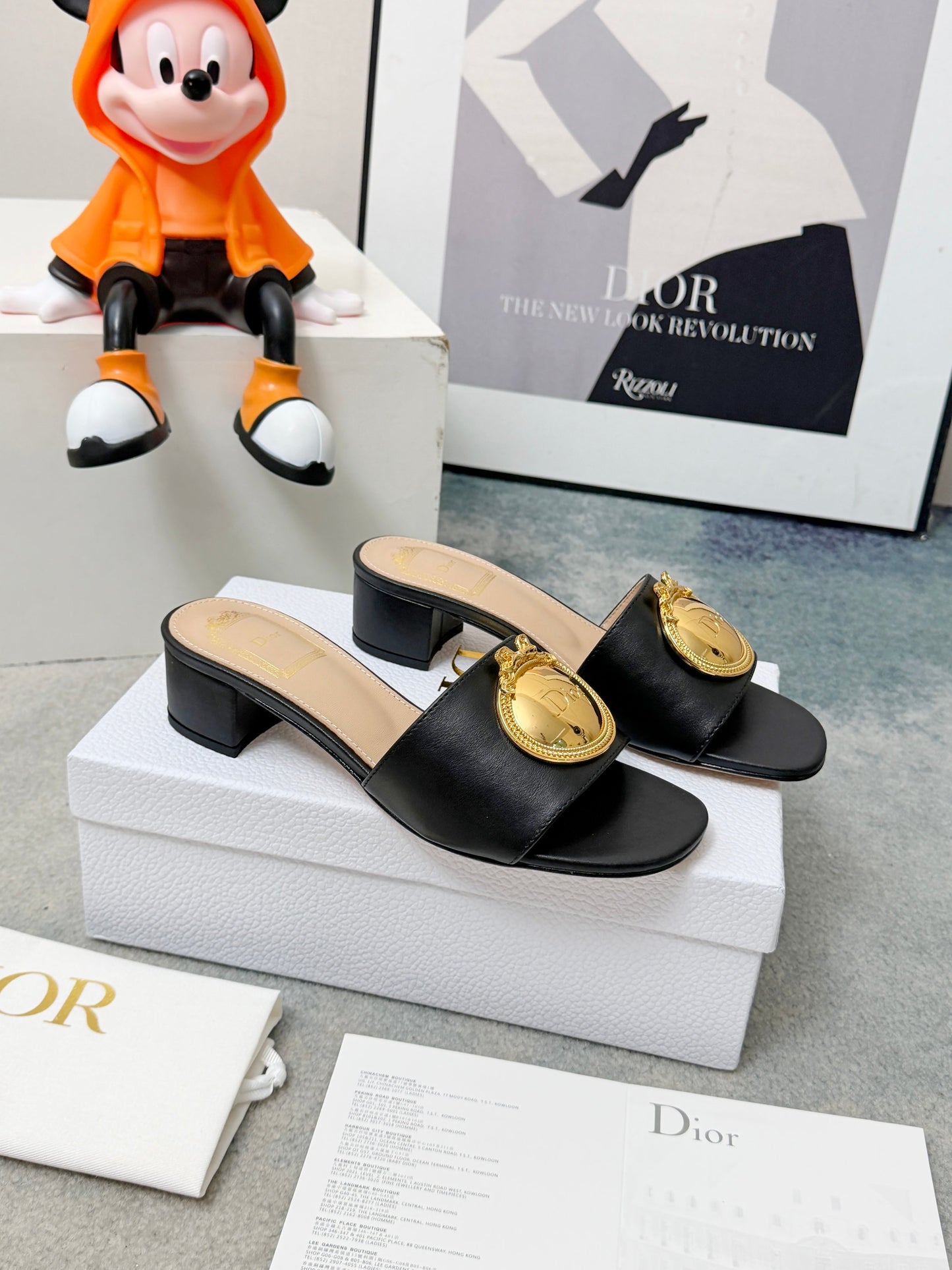 CD Heeled Mules – Smooth Black Lambskin Slide Sandals with Oversized Gold-Tone Medallion