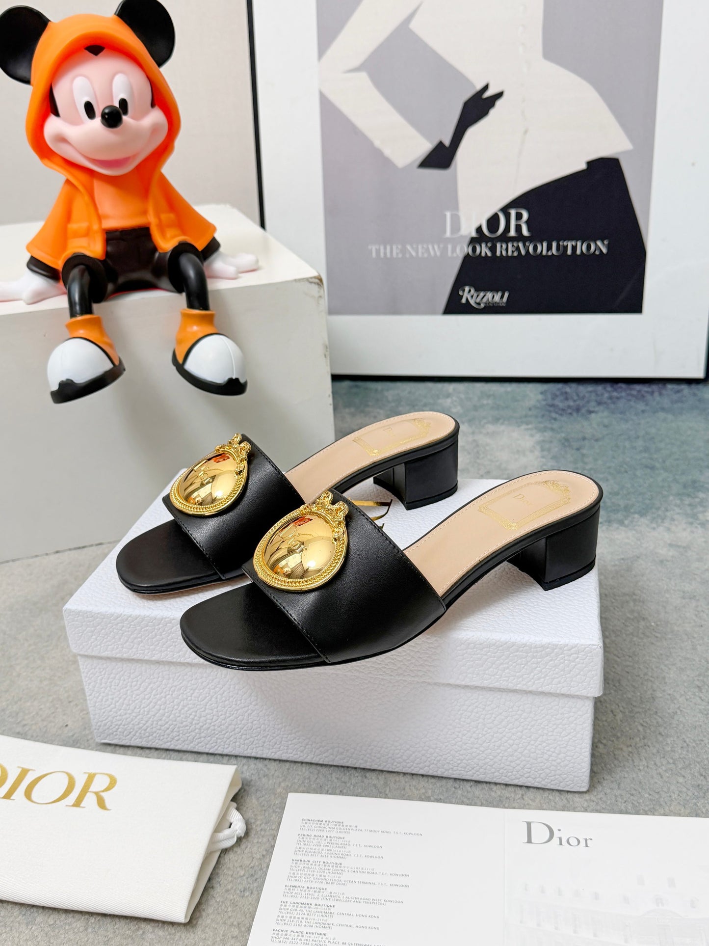CD Heeled Mules – Smooth Black Lambskin Slide Sandals with Oversized Gold-Tone Medallion