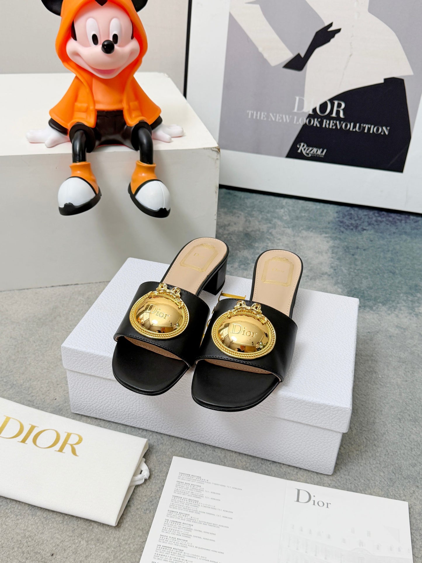 CD Heeled Mules – Smooth Black Lambskin Slide Sandals with Oversized Gold-Tone Medallion