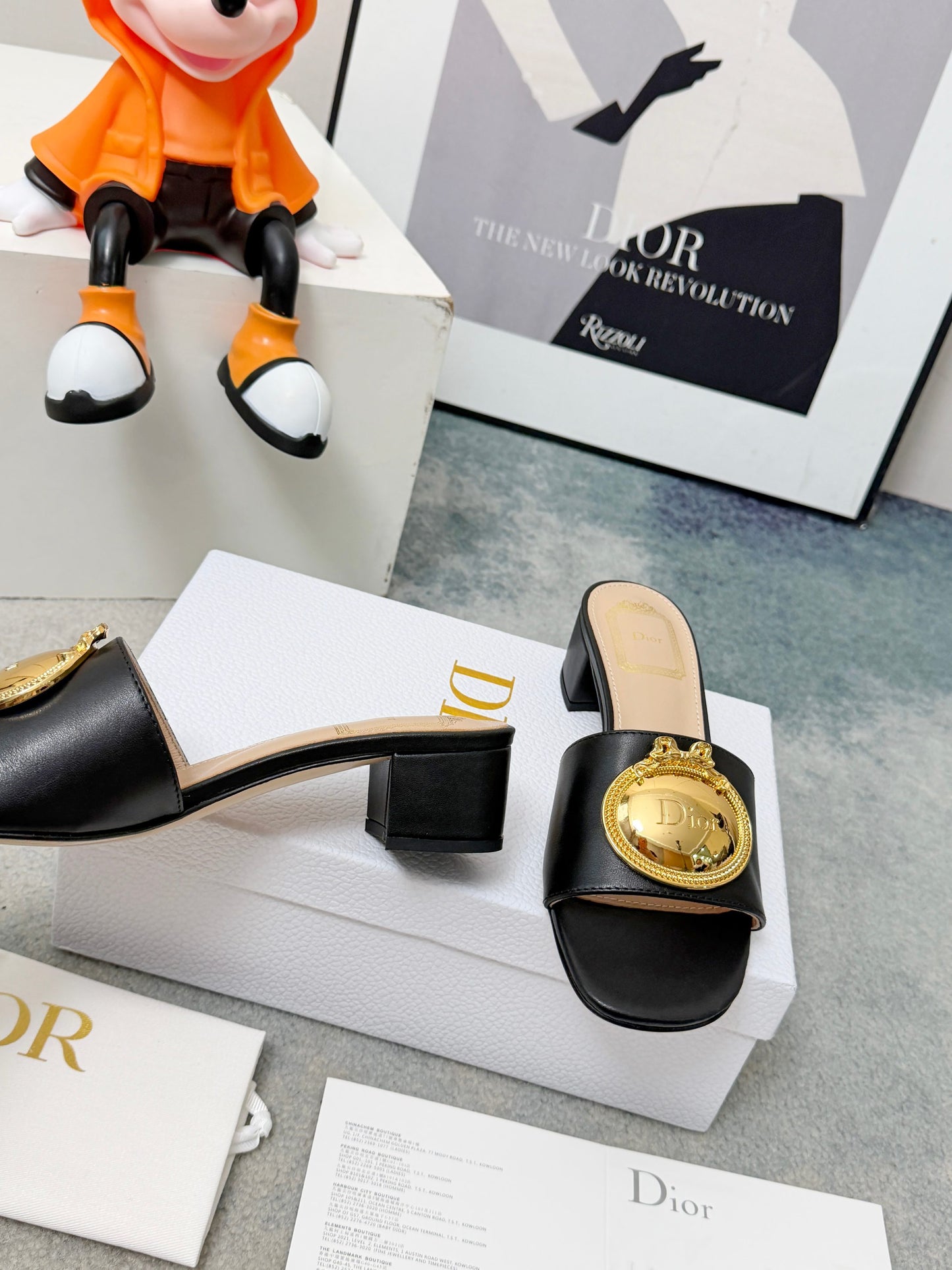 CD Heeled Mules – Smooth Black Lambskin Slide Sandals with Oversized Gold-Tone Medallion