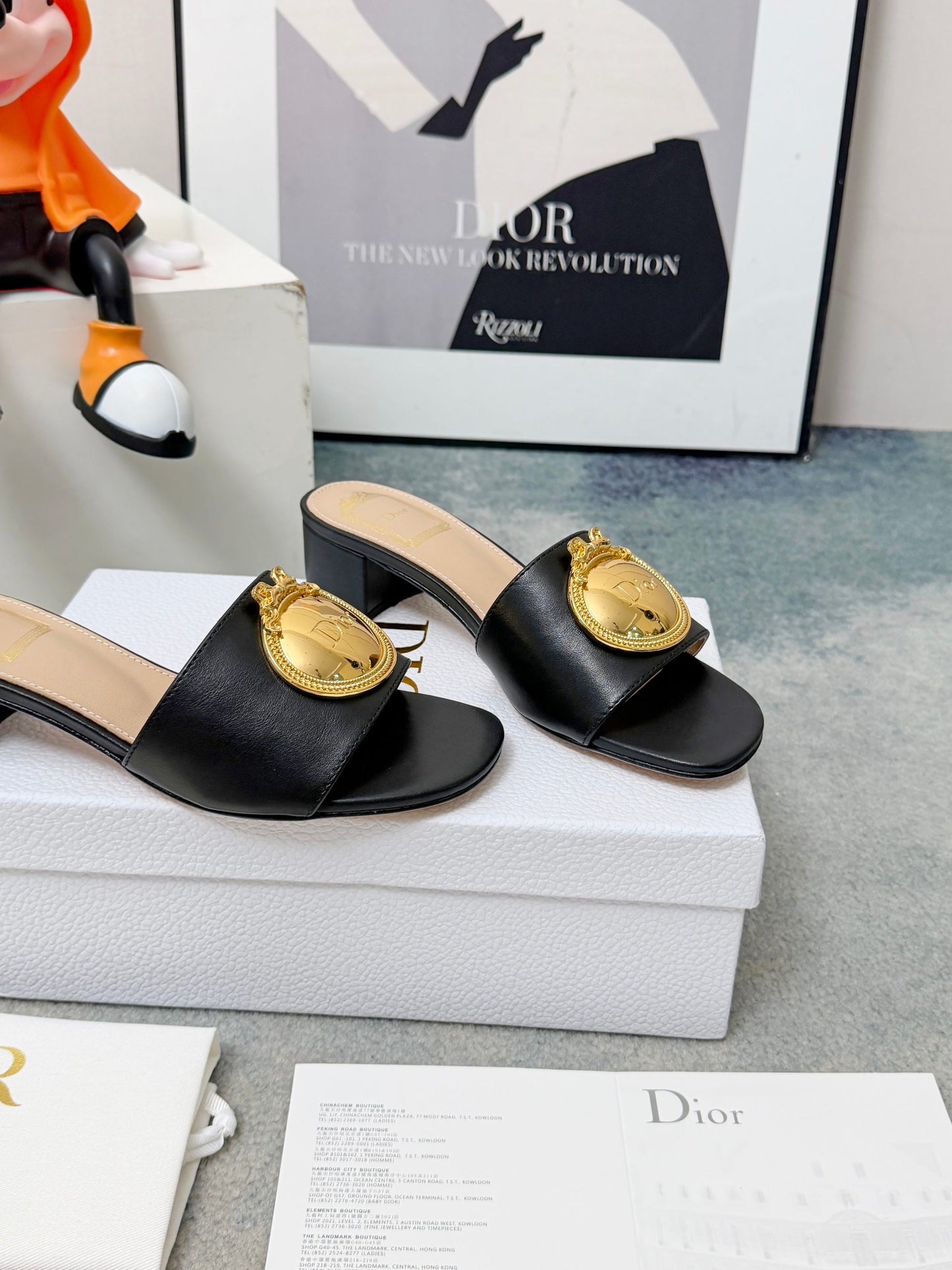 CD Heeled Mules – Smooth Black Lambskin Slide Sandals with Oversized Gold-Tone Medallion