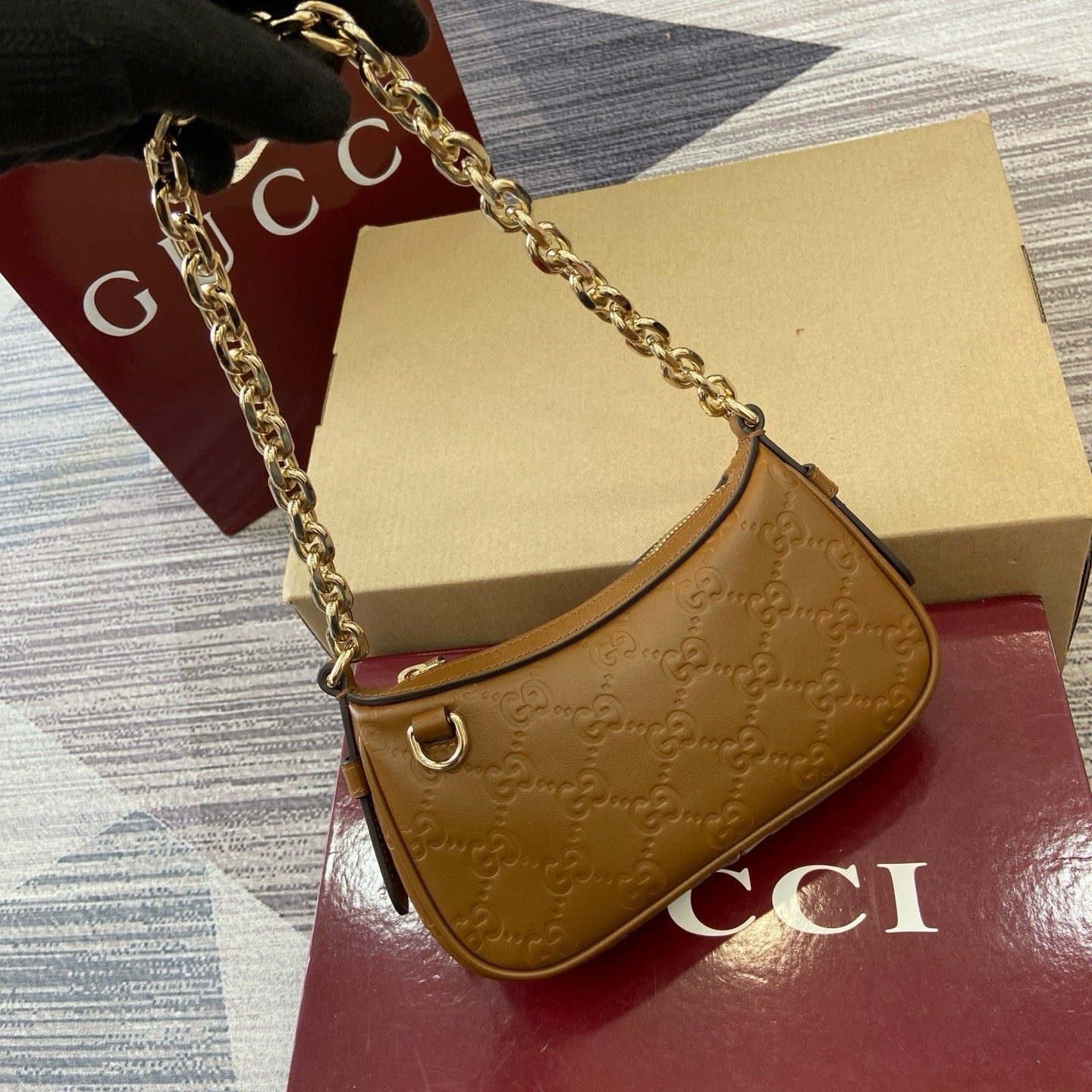 GG Signature Leather Mini Hobo Bag – Rich Cuir Brown Interlocking GG Debossed Guccissima Calfskin Shoulder Bag