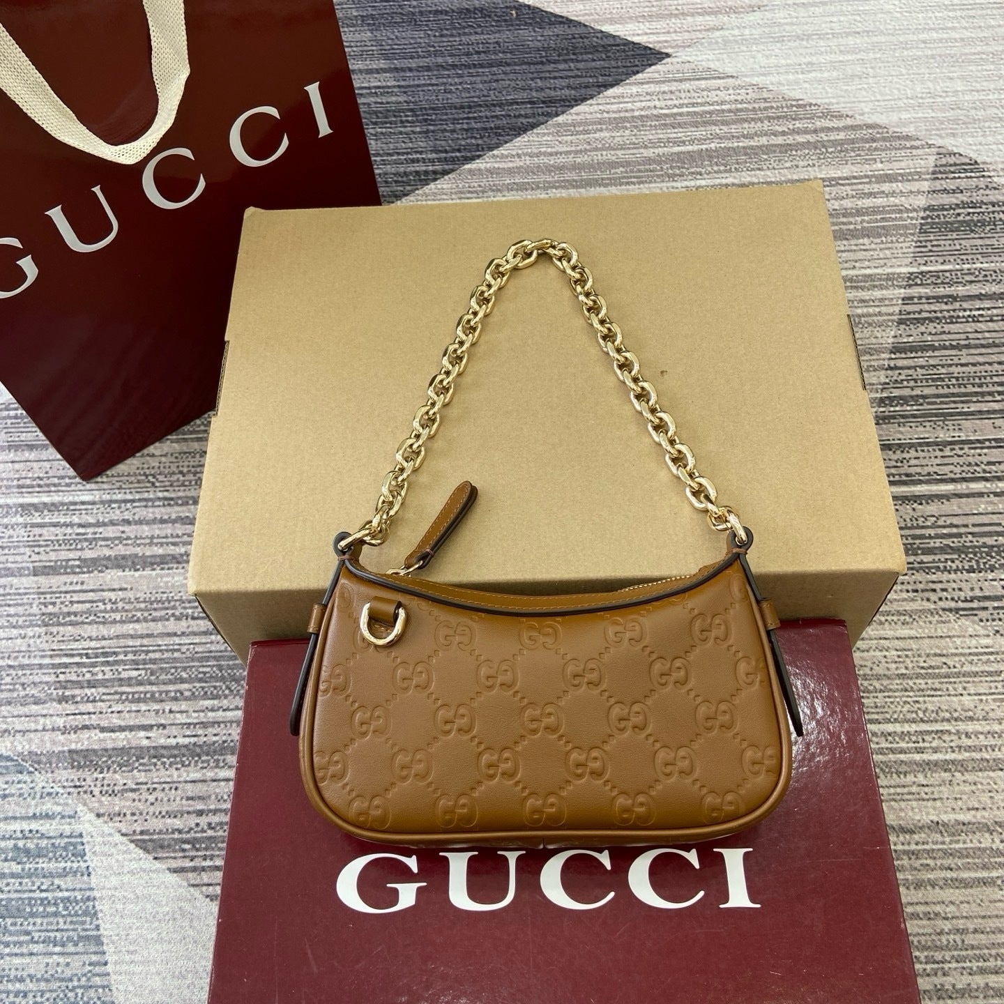 GG Signature Leather Mini Hobo Bag – Rich Cuir Brown Interlocking GG Debossed Guccissima Calfskin Shoulder Bag