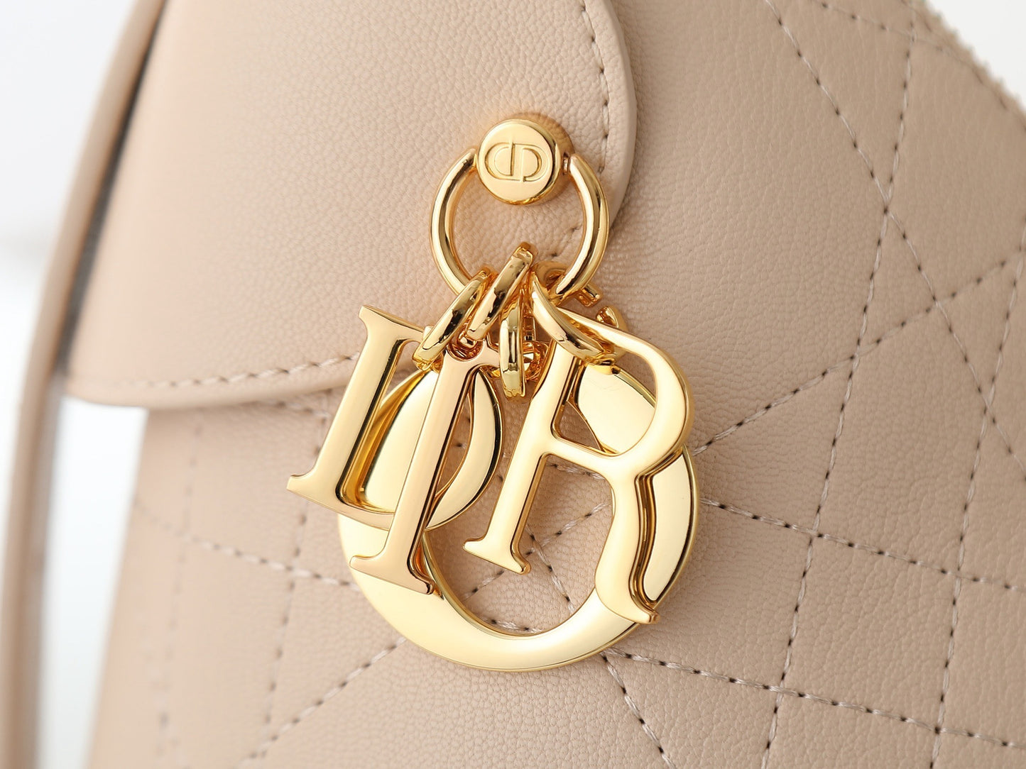 CD Voyage Bag – Powder Beige Flat Macrocannage Grained Calfskin