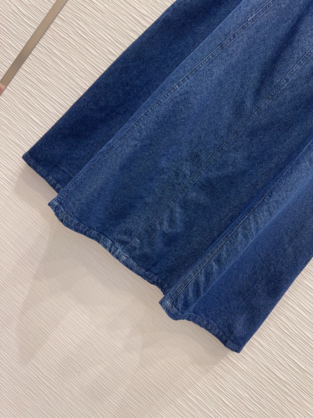 Anagram Embroidered Denim Midi Skirt – Deep Indigo Dark-Blue Structured Cotton Denim High-Rise Flared A-Line Skirt