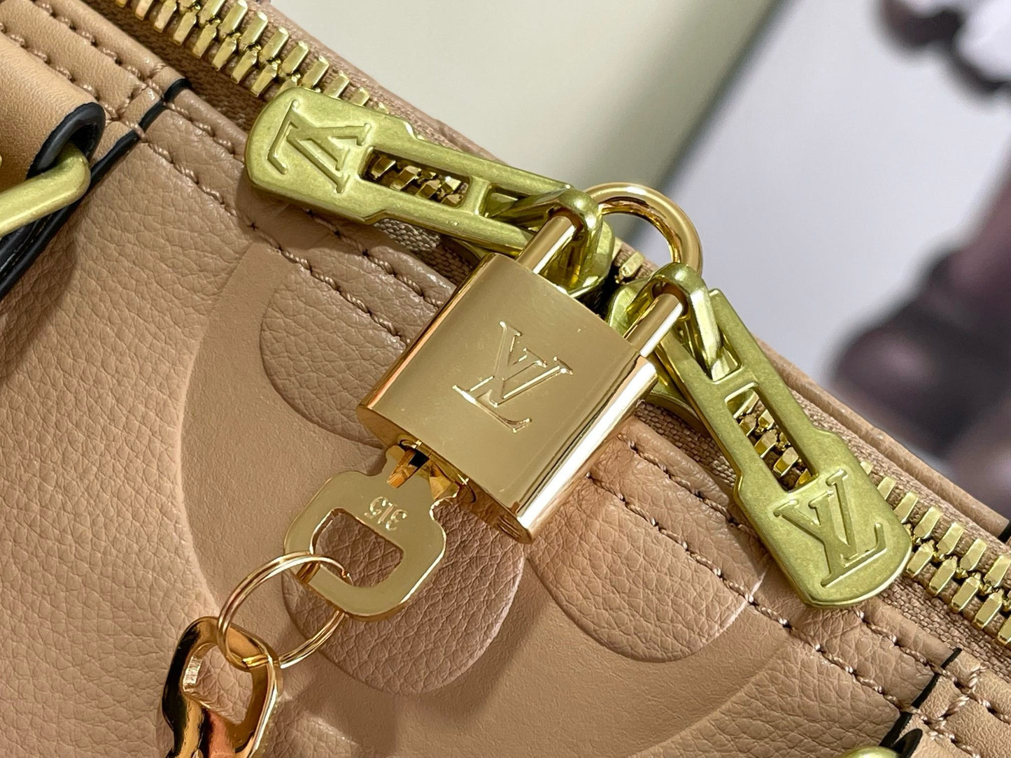 LV Keepall Bandoulière 45 – Tourterelle Taupe-Grey Giant Monogram Empreinte Leather Travel Duffel