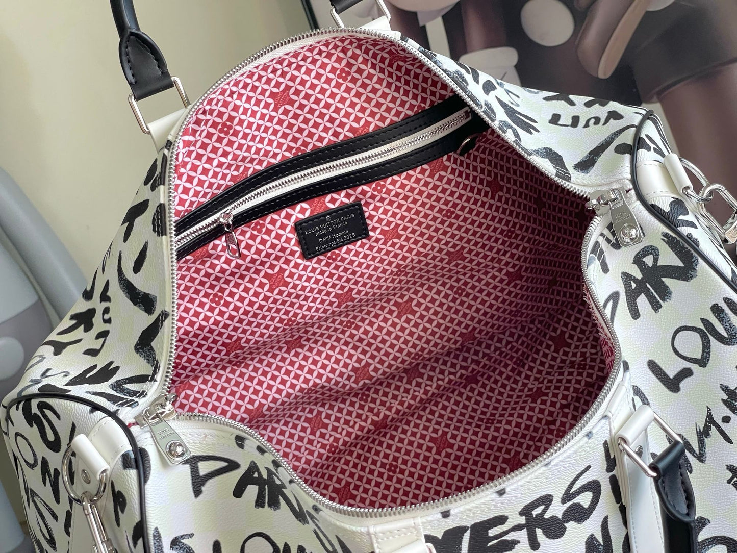 LV Keepall Bandoulière Optic White Coated Canvas Weekender with Ink-Black Brushstroke Typography