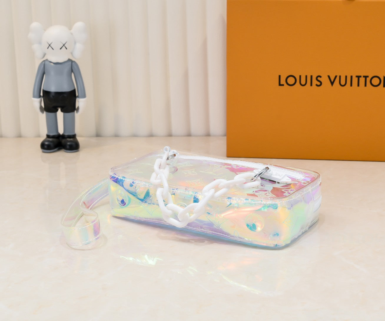 LV Monogram Prism Pochette Volga – Iridescent PVC with Matte White Resin Chain