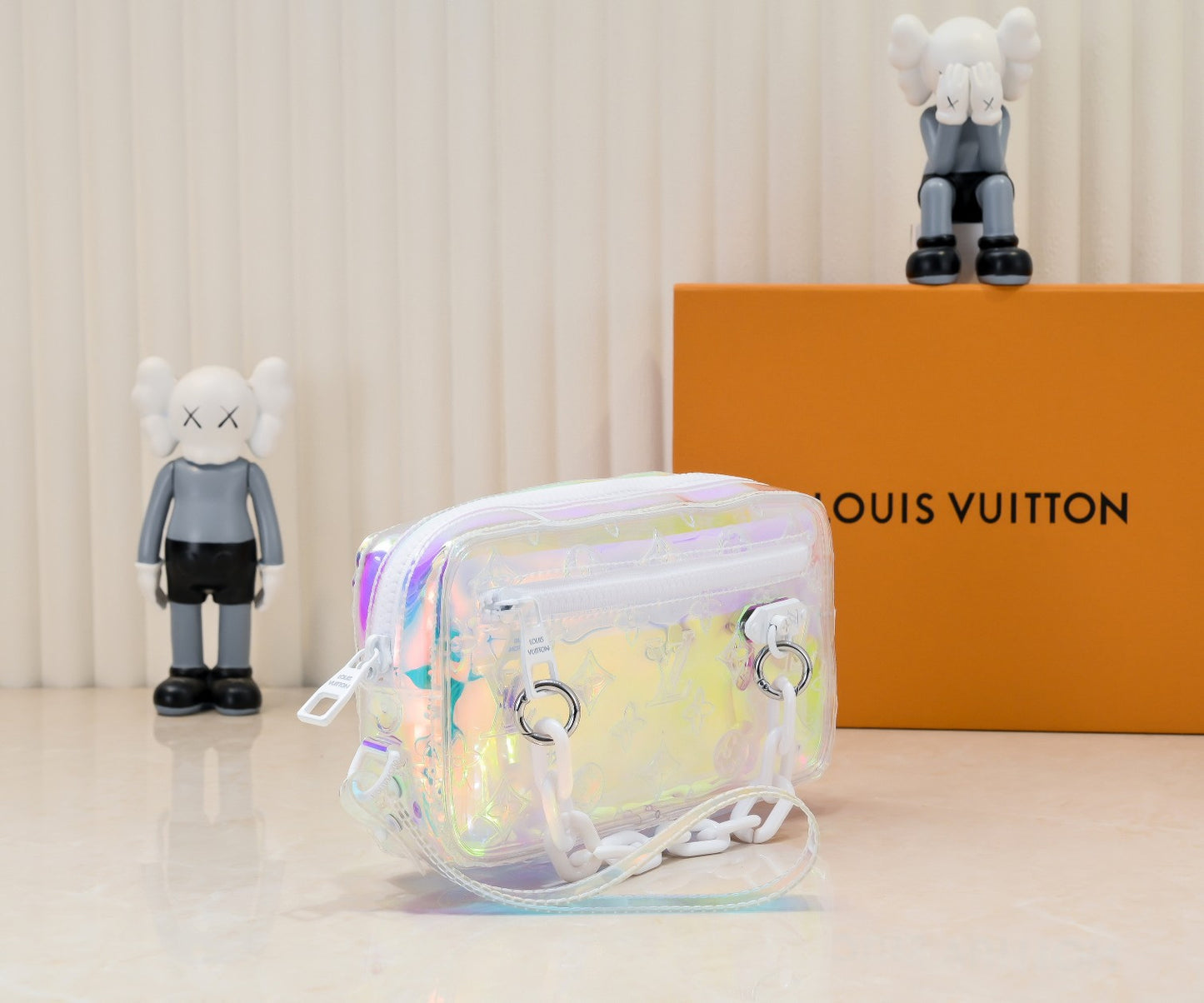 LV Monogram Prism Pochette Volga – Iridescent PVC with Matte White Resin Chain