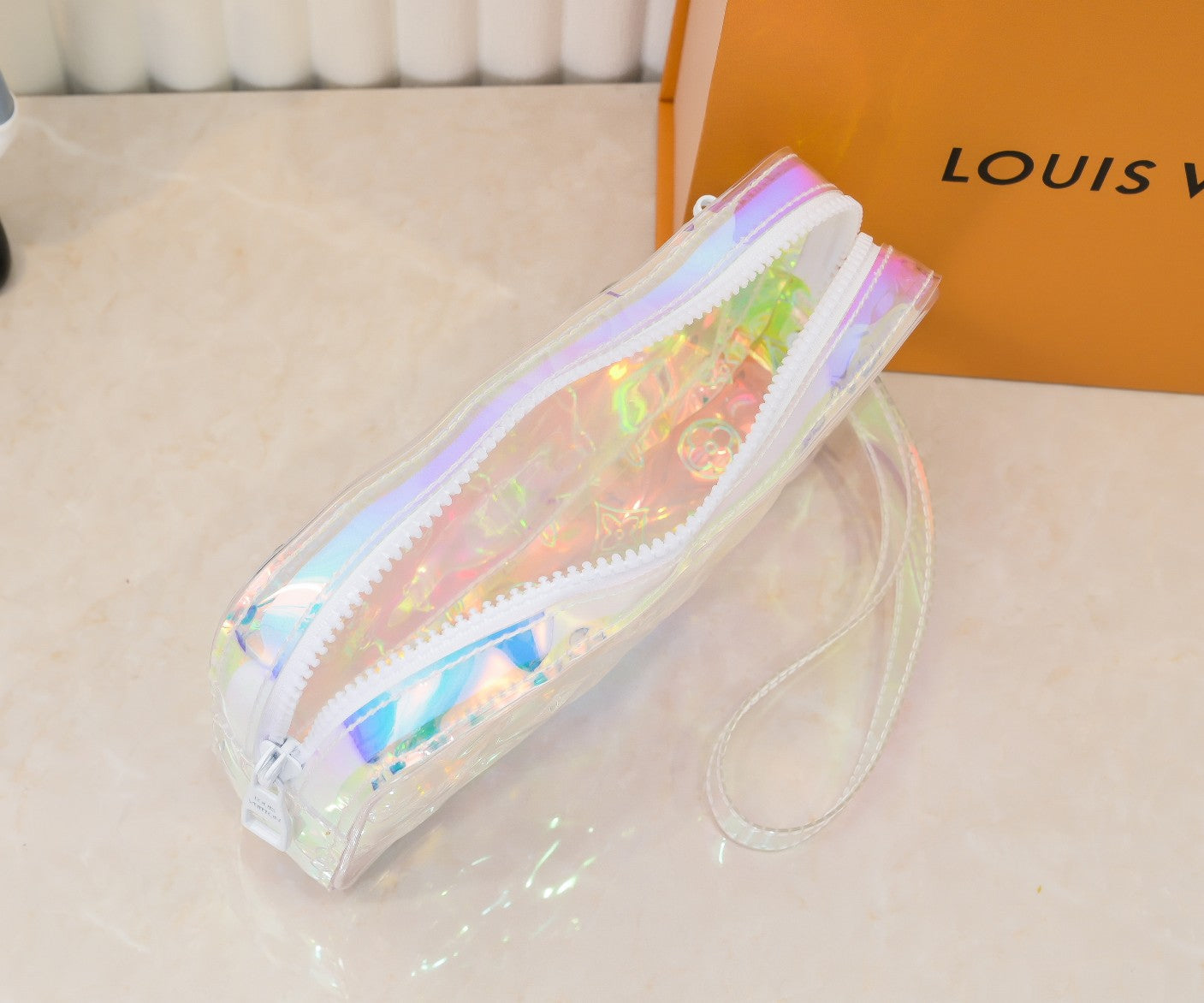 LV Monogram Prism Pochette Volga – Iridescent PVC with Matte White Resin Chain