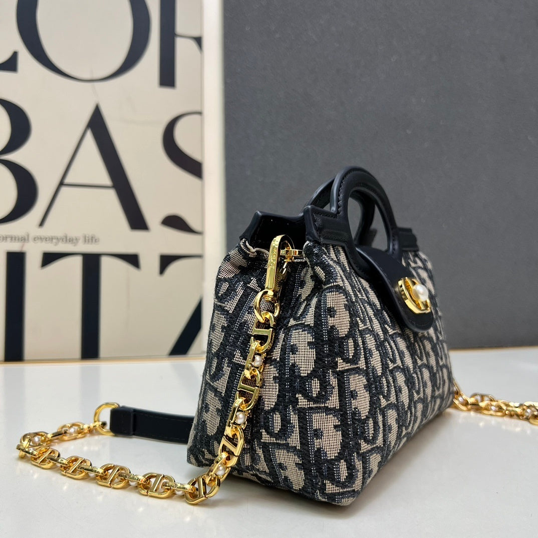 Christian Bobby East-West Bag – Blue Oblique Jacquard Canvas with Gold-Tone CD Buckle
